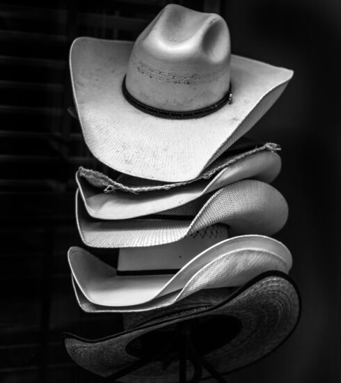 grayscale photography of piled cowboy hats